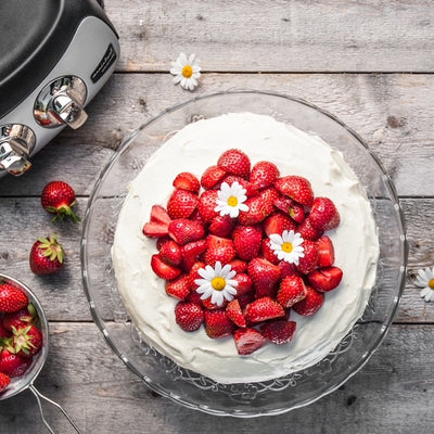 White chocolate cream cake topped with Strawberries